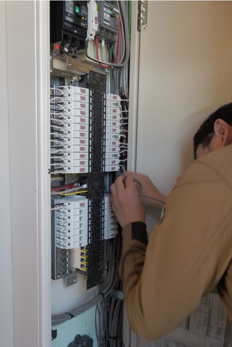 Engineer working with electrical cables